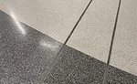 Floor expansion joint covers incorporate the same finished Terrazzo as the surrounding floor for a smooth surface transition that meets ADA guidelines for slip resistance. 