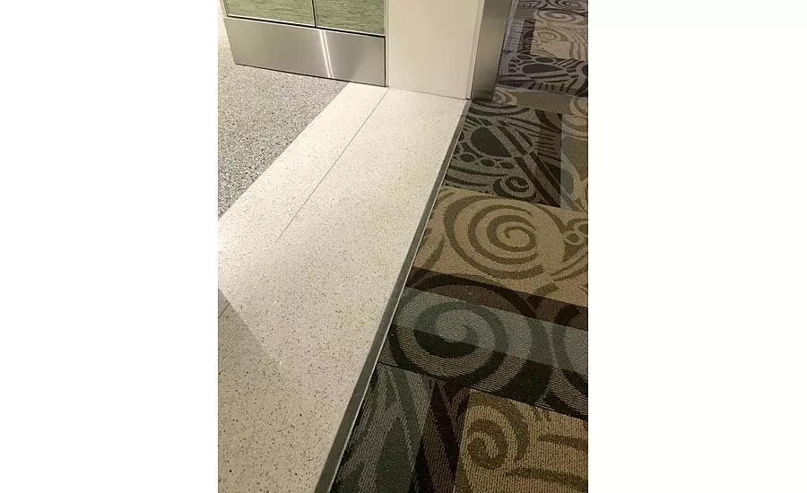 Interior construction within the new Terminal D at the new BNA Vision addition of the Nashville International Airport shows where the expansion joint covers for the floor, wall and ceiling will be installed.