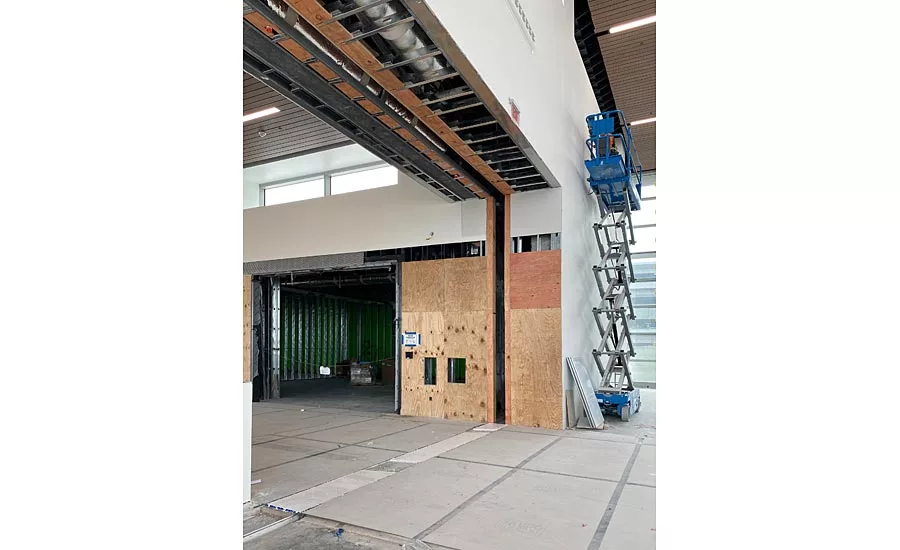 Floor pan expansion joint cover and flush mounted wall and ceiling expansion joint covers create a seamless transition and coordinated aesthetic in the Baggage Claim area at the new BNA Vision addition of the Nashville International Airport