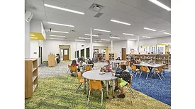 Rockfon De Zavala Elementary School Children Sitting At Library Tables