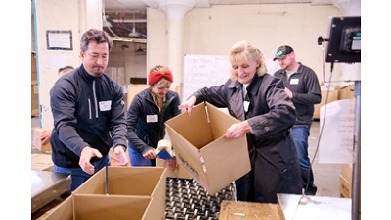 AD March 2023 Giving Back Event Packing Boxes Of Food