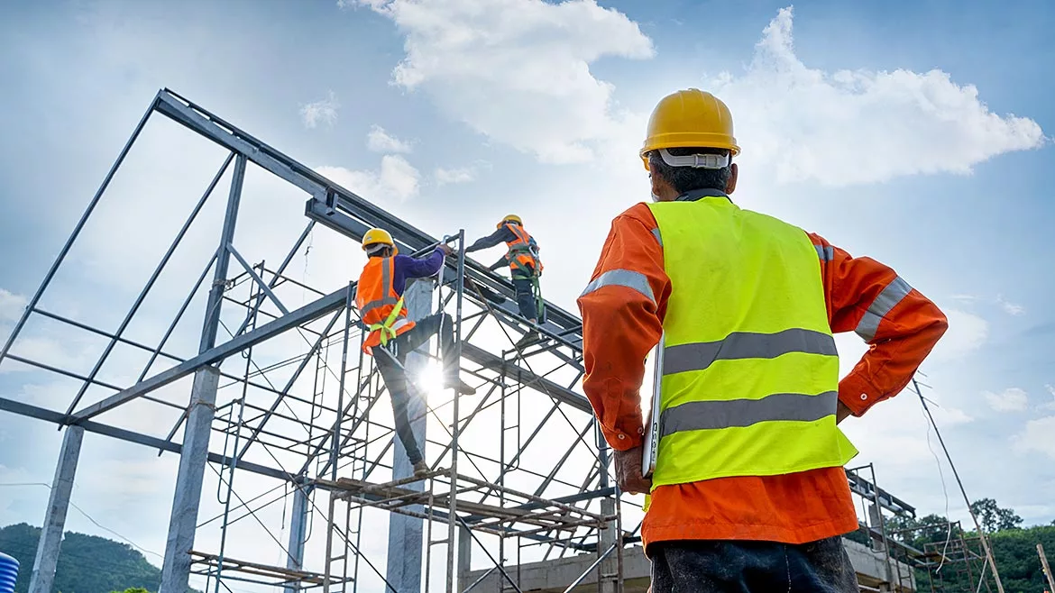 Construction Workers Climbing Scaffolding