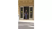 Technician Walking Through Automatic Doors