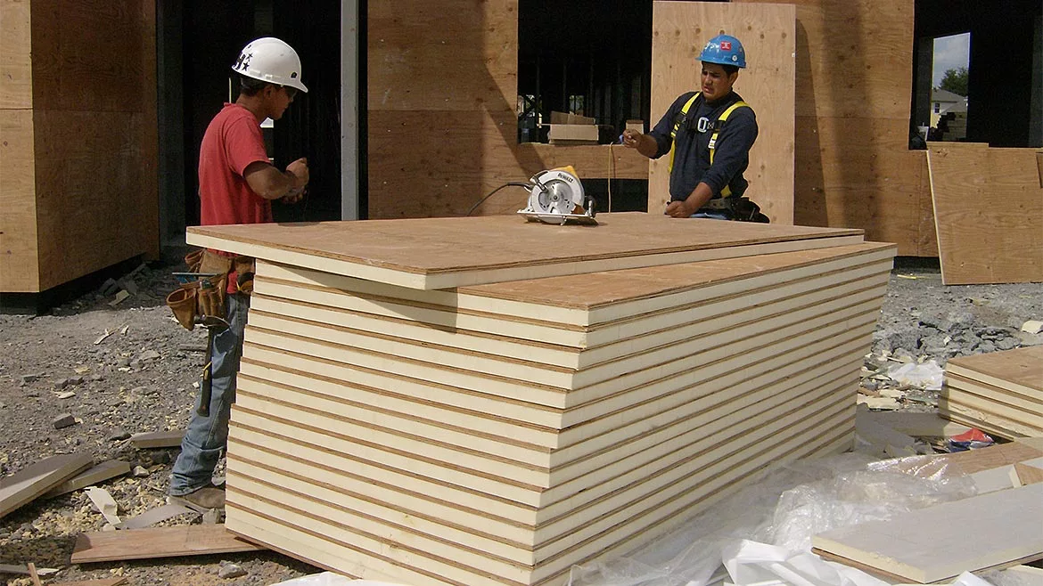 Two men at a construction site