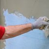 Stucco being applied to a wall