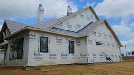 A house with Tyvek weatherproofing and no siding