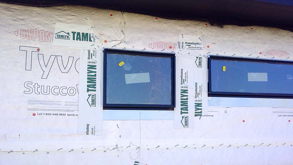 New windows surrounded by a weatherproofing layer