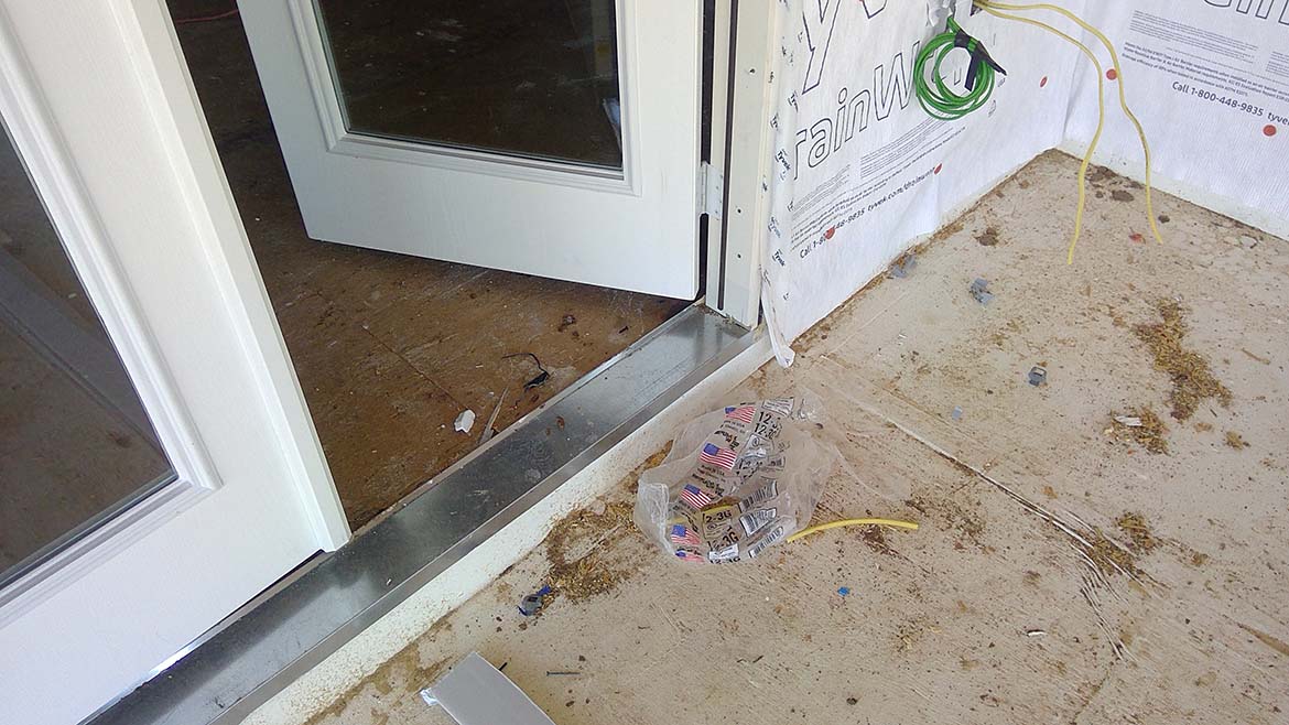 An open door surrounded by weatherproofing