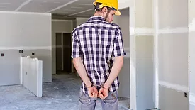 A contractor in handcuffs