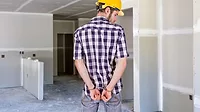 A contractor in handcuffs
