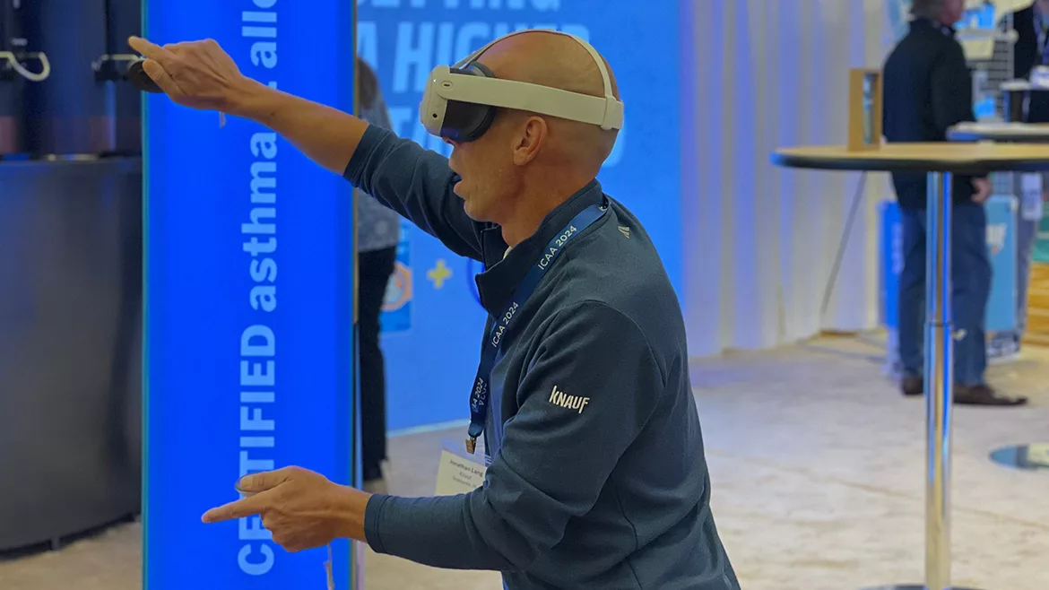 A man trying out a Virtual Reality headset