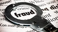Stock art of a handcuff framing the word 'fraud'