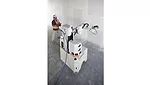 A construction worker with a drywall Robot
