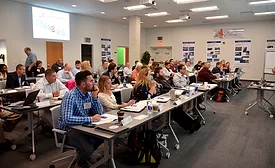 Attendees sit through ACI seminar