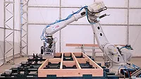 A robot building a frame A robot building a frame