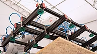 A robot being used to install a framing system A robot being used to install a framing system