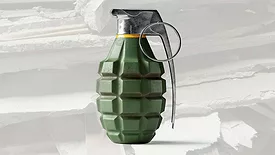 A picture of a grenade with crumbled gypsum board as a backdrop