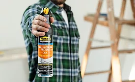 contractor holding the spray can