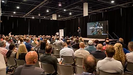 Attendees at METALCON 2025 watching the keynote speaker