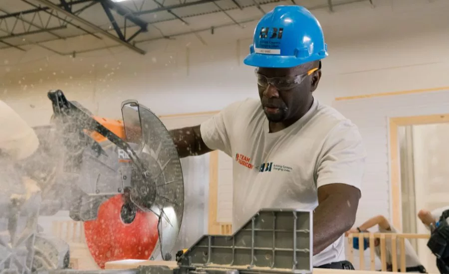 a student using a table saw