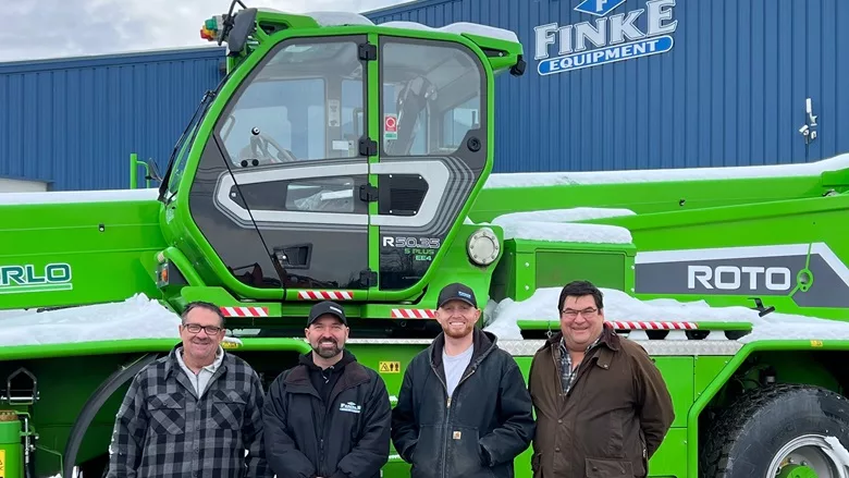 Finke and Merlo staff pose a picture announcing its dealership arrangment
