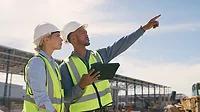 WC0126-FEAT-ConstructionForecast-p1FT-GettyImages-1499135865.jpg 2 construction workers looking to the future. One of them sees a bird.