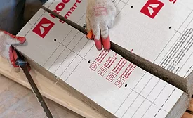 ROCKWOOL Smartrock in a pile with a glove on top
