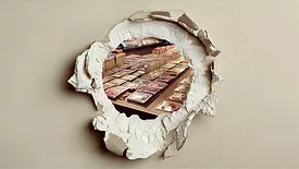 Punctured drywall with Pokemon cards