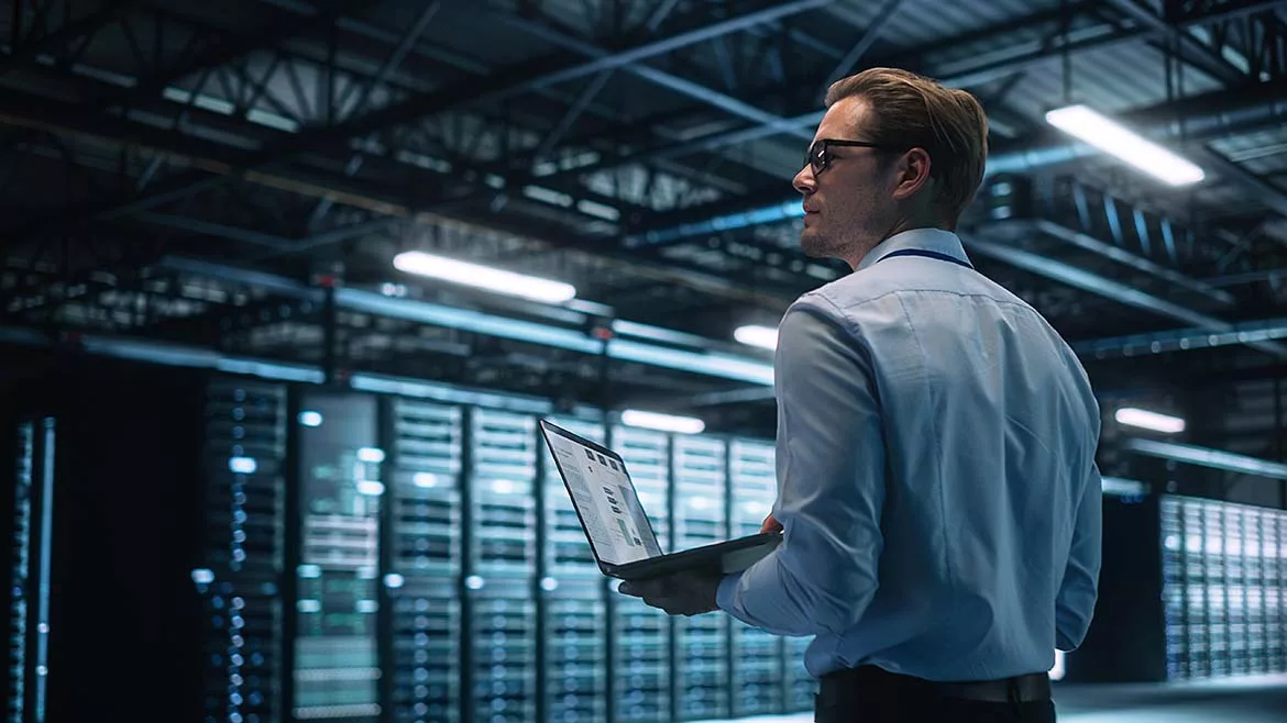 A man working in a data center