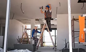 contractors working on ceiling with ladder