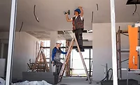contractors working on ceiling with ladder