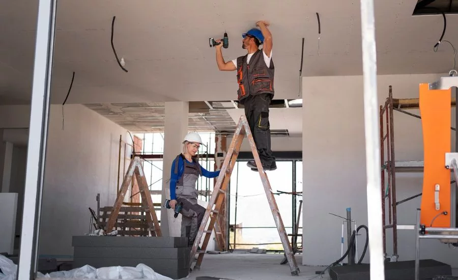 contractors working on ceiling with ladder