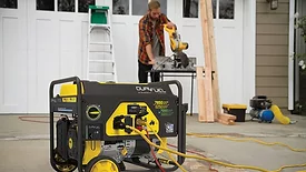A man on a jobsite with a portable generator