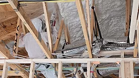 Applying spray foam Insulation