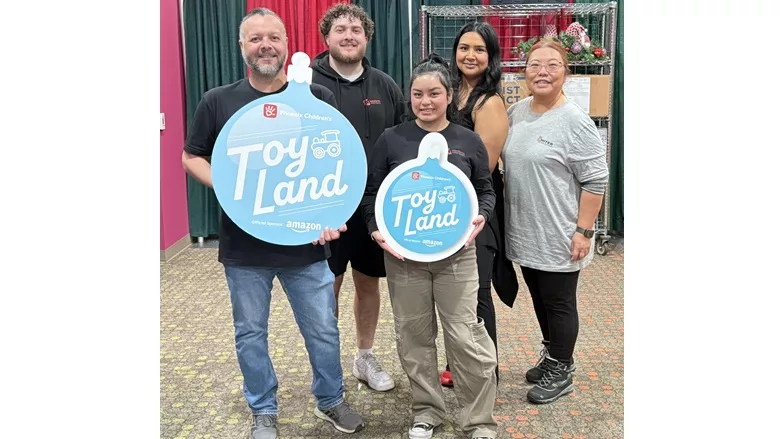 MITER Brands team members volunteering at the Phoenix Children’s Hospital Toy Land holiday initiative in December 2025, providing toys to patients and their siblings.
