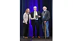 Andre Desjarlais receives Board Recognition award from Board Chair Andrea Wagner Watts, and Laverne Dalgleish of Building Professionals