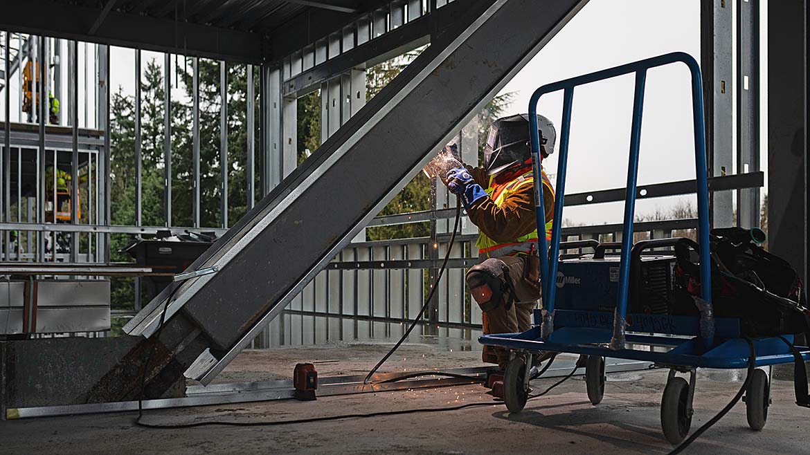 GK Knutson team member welding and working on the metal framing for the Pacific Middle School
