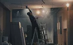drywall contractor sanding ceiling