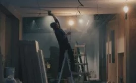 drywall contractor sanding ceiling