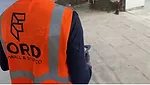 A Ford Drywall employee working the Dusty product