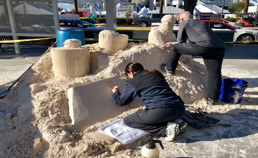 Sean-and-Tracy-sculpt-away-on-sand-pile.jpg