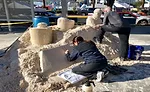 Sean-and-Tracy-sculpt-away-on-sand-pile.jpg