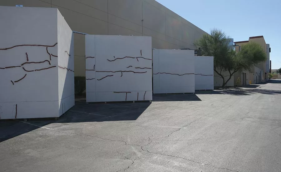 Five wall assemblies with cracks painted for visual location