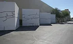 Five wall assemblies with cracks painted for visual location