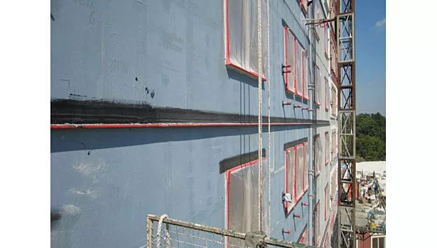 Liquid applied fenestration flashing incorporated into WRB.